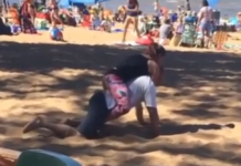 A BJJ practitioner finishes a person with a Rear Naked Choke (RNC) submission.